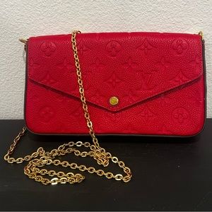 Louis Vuitton Felicie Pochette Monogram Empreinte Leather in scarlet.
